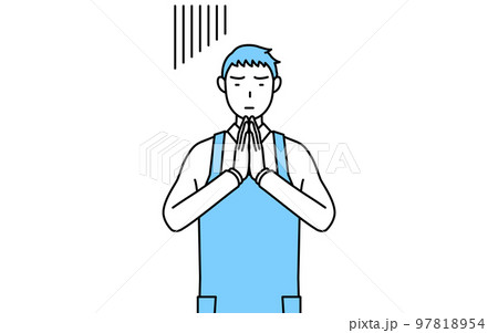 体の前で手を合わせて謝るエプロンを着た男性 97818954