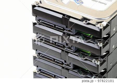 pile or stack of HDD, SSHD Hybrid hard disk drives 3.5" standard profile show on SATA interface, isolated on white background 97822101