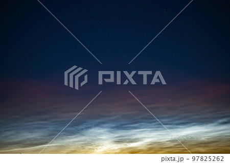 Silver clouds in the night sky in Russia. Silver clouds in the night sky in Russia. 97825262