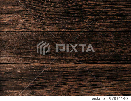 風化して彫りの深い木目となった黒褐色の古材が張られた板壁の表面の背景画像 97834140