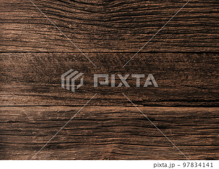 風化して彫りの深い木目となった焦げ茶色の古材が張られた板壁の表面の背景画像 97834141
