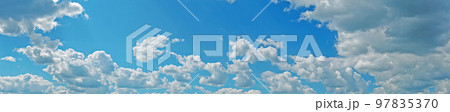 Blue sky with fluffy clouds wide background Blue sky with fluffy clouds wide background 97835370