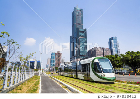 Low angle view of circular light rail train and the metropolitan building in Kaohsiung, Taiwan. The Circular Light Rail System in Kaohsiung is the first in Taiwan. 97838412