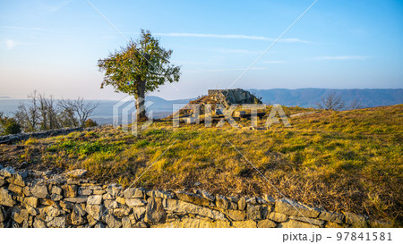 Kalich medieval castle ruins on the mountain summit. Used by Hussite movement army leader Jan Zizka of Trocnov. Trebusin village in Central Bohemian Uplands, Czech Republic 97841581