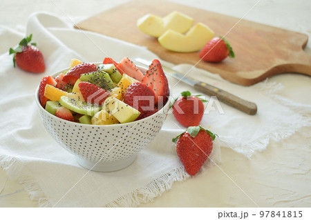 Bowl of fresh fruit salad, kiwi, apples, oranges Bowl of fresh fruit salad, kiwi, apples, oranges 97841815