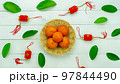 Chinese language mean rich or wealthy and happy.Top view aerial image decoration Chinese new year  lunar new year holiday background concept.Flat lay red orange with blossom on modern  white table. 97844490