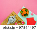 Chinese language mean rich or wealthy and happy.Top view aerial image decoration Chinese new year  lunar new year holiday background concept.Flat lay red orange with blossom on modern  paper. 97844497