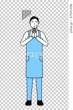 体の前で手を合わせて謝るエプロンを着たシニア男性 97845496