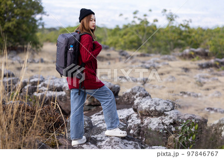 Young woman on top of the mountain enjoying with trekking travel. 97846767