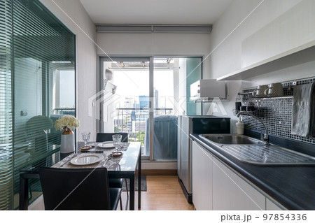 Kitchen Interior with sink, cabinets, and wood floors in luxury room. Kitchen Interior with sink, cabinets, and wood floors in luxury room. 97854336