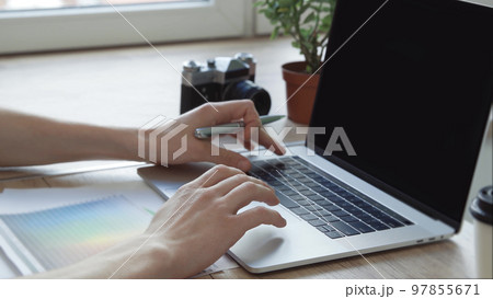 young designer choosing the right color for a new project. blank screen for your text young designer choosing the right color for a new project. blank screen for your text 97855671