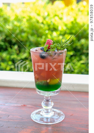Mixed berry juice with mint on the wooden table 97858039