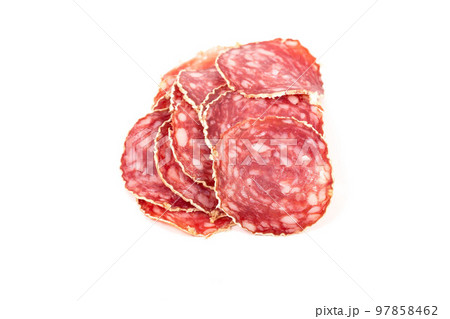 Slices of salami sausage on a white background Slices of salami sausage on a white background 97858462