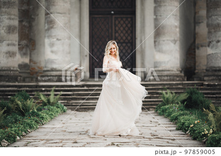 Portrait of a beautiful fashion bride, sweet and sensual. Wedding make up and hair 97859005