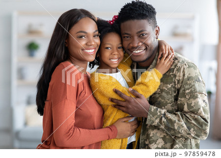 Military Family. Portrait Of African American Male Soldier With Wife And Daughter 97859478