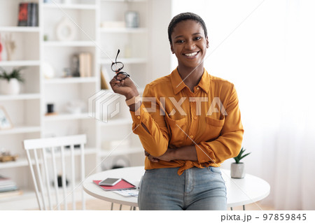 Happy young black woman posing at home 97859845