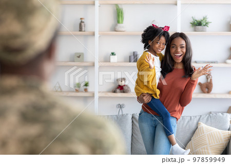 Joyful Young Black Wife And Little Daughter Welcoming Military Father At Home 97859949