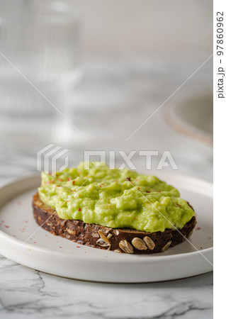 Healthy avocado toasts Healthy avocado toasts 97860962