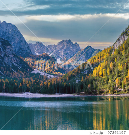 Autumn peaceful alpine lake Braies or Pragser Wildsee. Fanes-Sennes-Prags national park, South Tyrol, Dolomites Alps, Italy, Europe. Picturesque traveling, seasonal and nature beauty concept scene. Autumn peaceful alpine lake Braies or Pragser Wildsee. Fanes-Sennes-Prags national park, South Tyrol, Dolomites Alps, Italy, Europe. Picturesque traveling, seasonal and nature beauty concept scene. 97861197