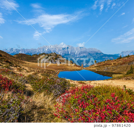Autumn alpine Kleiner Paarsee or Paarseen lake, Land Salzburg, Austria. Alps Hochkonig rocky mountain group view in far. Autumn alpine Kleiner Paarsee or Paarseen lake, Land Salzburg, Austria. Alps Hochkonig rocky mountain group view in far. 97861420