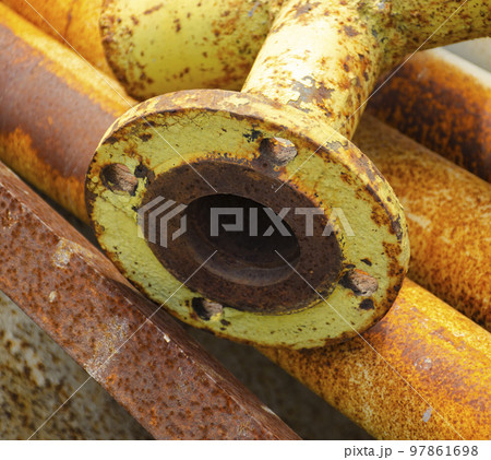 Old rusty metal pipe connection. Scrap metal - predominantly ferrous metals. Waste from industry. Old rusty metal pipe connection. Scrap metal - predominantly ferrous metals. Waste from industry. 97861698