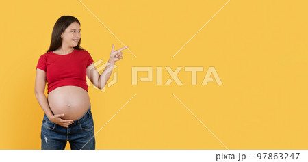 Nice Offer. Smiling Young Pregnant Lady Pointing Aside At Copy Space 97863247