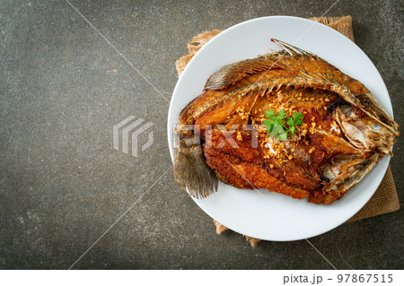 Fried Sea Bass Fish with Garlic 97867515