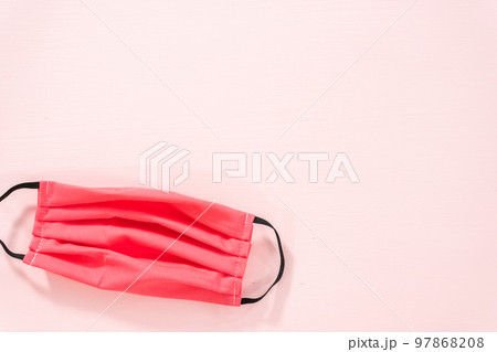 Homemade face masks for coronavirus outbreak on a pink background. Homemade face masks for coronavirus outbreak on a pink background. 97868208