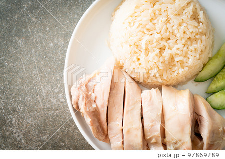 Hainanese chicken rice or rice steamed with chicken soup Hainanese chicken rice or rice steamed with chicken soup 97869289