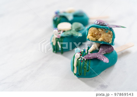 Sliced cakesicles with a chocolate mermaid tail. Sliced cakesicles with a chocolate mermaid tail. 97869543