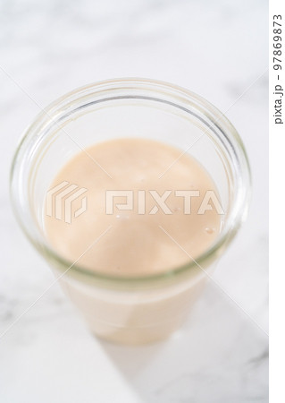 Lemon glaze. Lemon glaze in a glass jar. 97869873