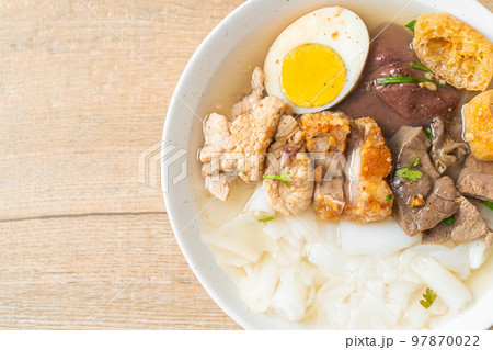 paste of rice flour or boiled Chinese pasta square in clear soup 97870022