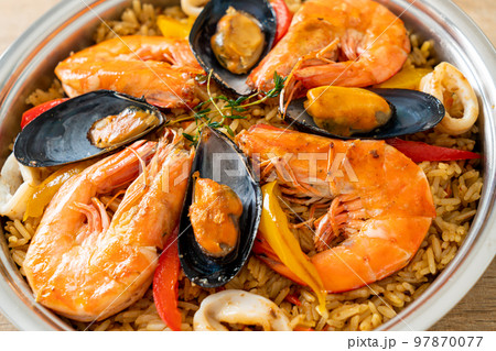 Seafood Paella with prawns, clams, mussels on saffron rice 97870077