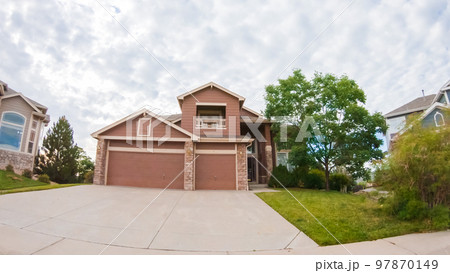 View of the typical suburban neighborhood on a summer morning. 97870149
