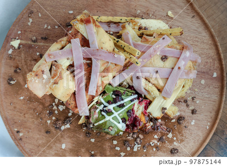 Brioche Truffle Ham Cheese Pumpkin Bread, mixed with Cheese Cake Christmas Protein Bar and mixed nuts sprinkle on the wooden tray. 97875144