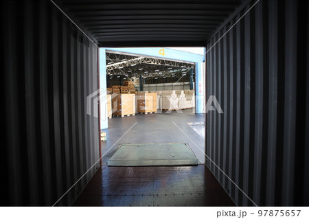 working at The Warehouse. Storehouse area, Shipment.  warehouse worker unloading pallet goods in warehouse 97875657