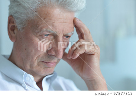 Portrait of sad sick old nice man with headache Portrait of sad sick old nice man with headache 97877315