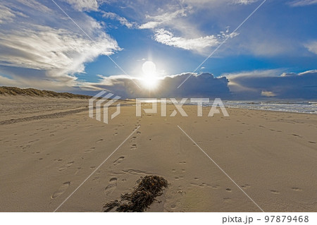Winter image of a North Sea beach near Vejers at sunset Winter image of a North Sea beach near Vejers at sunset 97879468