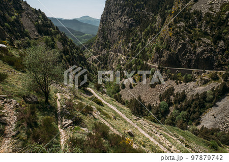 Panoramic view of a mountain gorge in the Vall de Nuria natural reserve in Spain, with trails for hiking in the mountains. A place where you can relax from the hustle and bustle of the city. 97879742