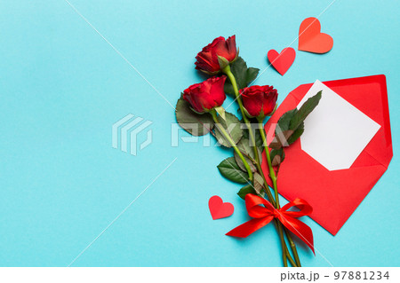 Valentine day composition with Envelope, rose flower and Red heart on table. Top view, flat lay. Holiday concept Valentine day composition with Envelope, rose flower and Red heart on table. Top view, flat lay. Holiday concept 97881234