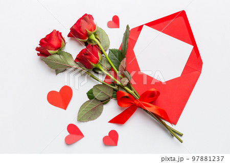 Valentine day composition with Envelope, rose flower and Red heart on table. Top view, flat lay. Holiday concept Valentine day composition with Envelope, rose flower and Red heart on table. Top view, flat lay. Holiday concept 97881237