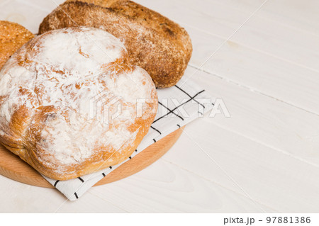 Homemade natural breads. Different kinds of fresh bread as background, perspective view with copy space 97881386