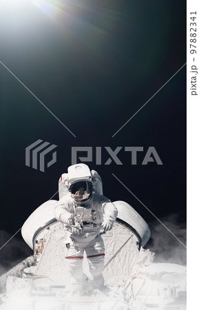 Astronaut and space background. Elements of this image furnished by NASA. 97882341