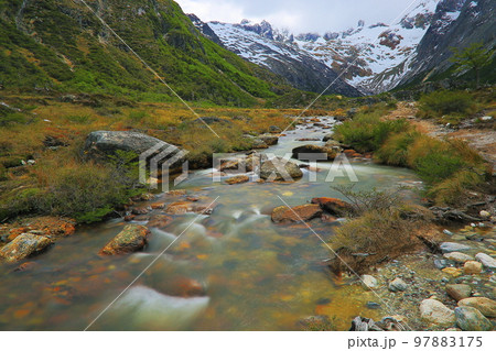 Melting frozen river, Andes landscape in Tierra Del fuego, Ushuaia, Argentina 97883175