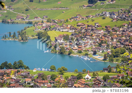 Turquoise Lungernsee and village lungern in the Swiss Alps, Switzerland 97883196