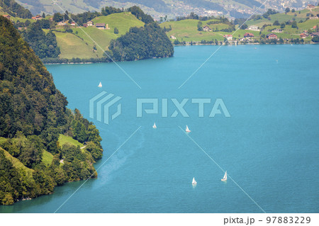 Turquoise Lungernsee and village lungern in the Swiss Alps, Switzerland 97883229
