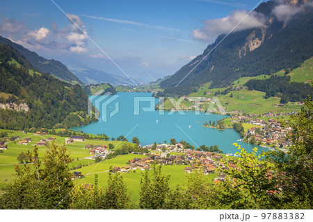 Turquoise Lungernsee and village lungern in the Swiss Alps, Switzerland Turquoise Lungernsee and village lungern in the Swiss Alps, Switzerland 97883382