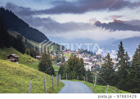 Snowcapped Bernese Swiss alps and Murren village, Switzerland Snowcapped Bernese Swiss alps and Murren village, Switzerland 97883429