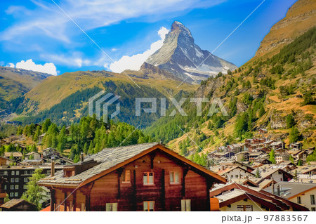 Matterhorn above zermatt idyllic valley at sunrise, Swiss Alps 97883567