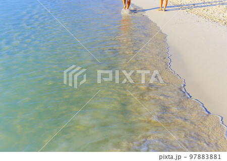 Couple walking on Secluded beach in Aruba, Caribbean Blue sea, Duth Antilles 97883881